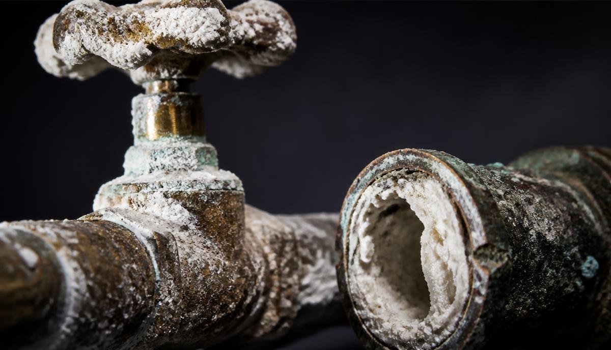 Close up of heavy white calcium and scale deposits inside a corroded water valve